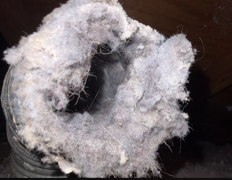 Dryer vent massive lint plug fire hazard before cleaning San Antonio Texas