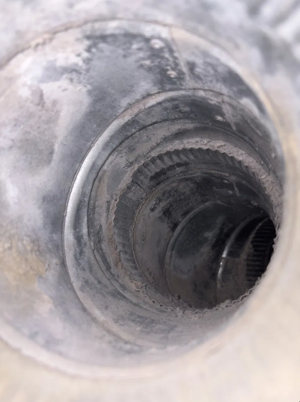 Dryer vent rigid metal duct heavy buildup interior view before cleaning San Antonio Texas