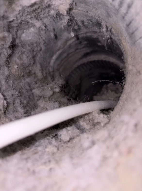 Dryer vent lint buildup inside flex duct before cleaning San Antonio Texas