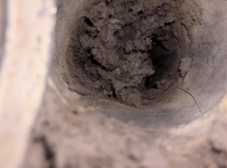 Dryer vent heavy lint buildup inside duct before cleaning San Antonio Texas